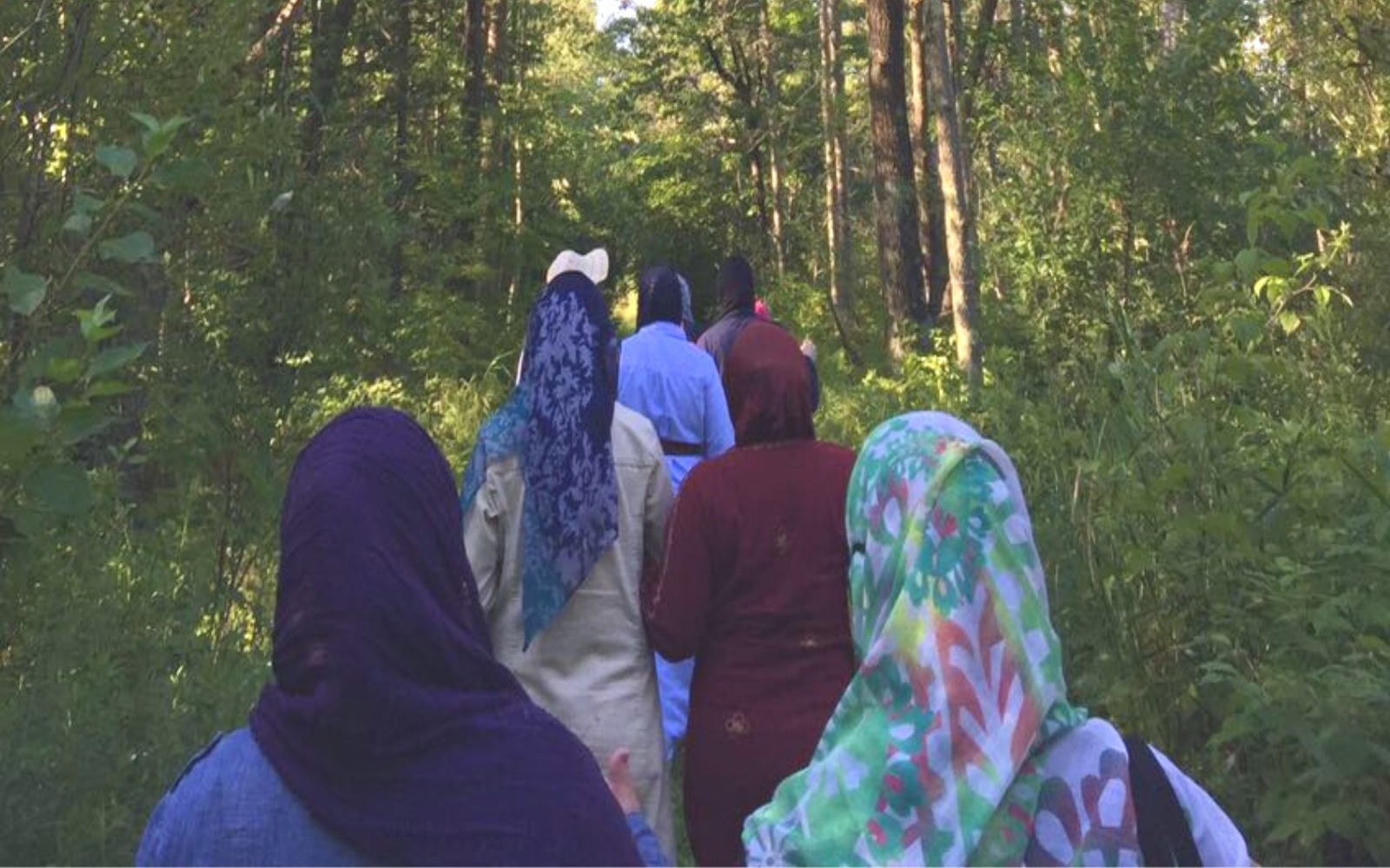 women walking in the forest